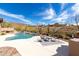 Backyard pool with mountain views and outdoor seating area at 42429 N Cross Timbers Ct, Anthem, AZ 85086