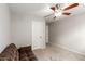 Bedroom featuring a ceiling fan, pull-out couch, and carpeted flooring at 4245 S 247Th Dr, Buckeye, AZ 85326