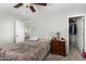 Cozy bedroom featuring a ceiling fan, closet, and neutral color scheme at 4245 S 247Th Dr, Buckeye, AZ 85326