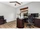 Functional home office with desk, cabinets and a large window providing natural light at 4245 S 247Th Dr, Buckeye, AZ 85326