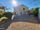 Exterior view of the home showcasing a spacious backyard area with shade and privacy at 4529 S Granite St, Gilbert, AZ 85297