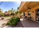 Covered back patio with ceiling fan, an outdoor kitchen, and desert landscaping at 4529 S Granite St, Gilbert, AZ 85297