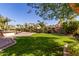 Lush backyard featuring mature landscaping, desert landscaping, manicured lawn and hardscape at 4529 S Granite St, Gilbert, AZ 85297