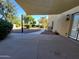 Covered patio overlooking a spacious backyard with mature trees and manicured landscaping at 4529 S Granite St, Gilbert, AZ 85297