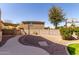 Backyard featuring desert landscaping, a concrete walkway, and a shaded patio area at 4529 S Granite St, Gilbert, AZ 85297