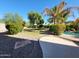 Beautiful lawn and landscaping with a patio area leading to the pool at 4529 S Granite St, Gilbert, AZ 85297