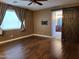 Bedroom features hardwood floors, a barn door leading to the bathroom, and natural light at 4529 S Granite St, Gilbert, AZ 85297