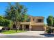 Charming two-story home with a well-manicured lawn, mature tree, and inviting curb appeal at 4529 S Granite St, Gilbert, AZ 85297