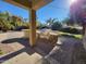 Covered outdoor kitchen with stainless steel grill and stone accents, perfect for entertaining at 4529 S Granite St, Gilbert, AZ 85297