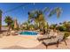 Sparkling pool, desert landscaping, and lounge chairs in a private backyard oasis at 4529 S Granite St, Gilbert, AZ 85297