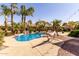 Backyard with a pool, lush desert landscaping, string lighting, and a hammock at 4529 S Granite St, Gilbert, AZ 85297