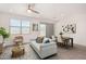 Comfortable living room showcases stylish furniture and decor with an open dining area and natural light at 4642 W Suncup Dr, San Tan Valley, AZ 85144