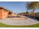 Beautiful backyard with a gazebo, fire pit, and a charming play area at 4702 N 151St Dr, Goodyear, AZ 85395