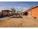 Expansive backyard with a gazebo, fire pit, and drought-resistant landscaping at 4702 N 151St Dr, Goodyear, AZ 85395