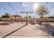 Serene backyard featuring a gazebo, fire pit, and elegant string lighting at 4702 N 151St Dr, Goodyear, AZ 85395