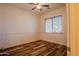 Bedroom featuring hard wood floors, ceiling fan, and a window bringing in natural light at 4702 N 151St Dr, Goodyear, AZ 85395