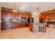 Stylish kitchen with granite countertops, stone accent walls, stainless appliances, and lots of cabinets at 4702 N 151St Dr, Goodyear, AZ 85395