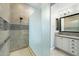 Sleek bathroom features tiled walk-in shower with glass partition and double sink vanity at 4777 S Fulton Ranch Blvd # 1098, Chandler, AZ 85248