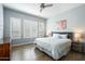 Relaxing bedroom with natural light, white plantation shutters, and a comfortable queen-size bed at 4777 S Fulton Ranch Blvd # 1098, Chandler, AZ 85248