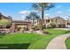 Beautifully landscaped community grounds and BBQ area with verdant lawns and palm trees at 4777 S Fulton Ranch Blvd # 1098, Chandler, AZ 85248