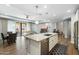 Bright kitchen island with stainless steel dishwasher, an undermount sink, and a view of the open living space at 4777 S Fulton Ranch Blvd # 1098, Chandler, AZ 85248