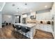 Spacious kitchen island with seating, pendant lighting, and a view into the modern living area at 4777 S Fulton Ranch Blvd # 1098, Chandler, AZ 85248