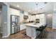 Modern kitchen featuring stainless steel appliances, a large island with seating, and beautiful cabinetry at 4777 S Fulton Ranch Blvd # 1098, Chandler, AZ 85248