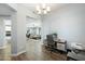 Home office area, adjacent to the living space, with a neutral color palette and hardwood floors at 4777 S Fulton Ranch Blvd # 1098, Chandler, AZ 85248