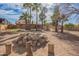 Spacious backyard featuring a fire pit and a view of the home at 6208 W Willow Ave, Glendale, AZ 85304