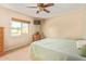 Comfortable bedroom featuring a neutral color scheme, window with blinds, and ceiling fan at 6208 W Willow Ave, Glendale, AZ 85304