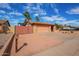 Single-story home with desert landscaping, RV gate, and attached garage at 6208 W Willow Ave, Glendale, AZ 85304