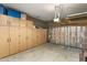 Spacious garage with epoxy flooring, built-in cabinets, and an insulated garage door at 6998 E Soaring Eagle Way, Scottsdale, AZ 85266