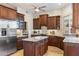 Spacious kitchen with granite countertops, stainless steel appliances, and a center island at 6998 E Soaring Eagle Way, Scottsdale, AZ 85266