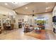 Open-concept living room with a fireplace, view of the desert, and neutral colors at 6998 E Soaring Eagle Way, Scottsdale, AZ 85266