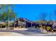 Elegant gated entrance with desert landscaping provides a secure welcome to the community at 7016 E Stone Raven Trl, Scottsdale, AZ 85266