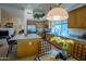 Well-lit kitchen featuring a large island, stainless steel appliances, and a breakfast nook at 7016 E Stone Raven Trl, Scottsdale, AZ 85266