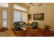 Bright living room with ample natural light, comfortable seating, and a glass coffee table at 7016 E Stone Raven Trl, Scottsdale, AZ 85266