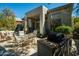 Inviting patio with an outdoor grill, dining set, and lush landscaping for outdoor enjoyment at 7016 E Stone Raven Trl, Scottsdale, AZ 85266