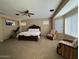 Expansive bedroom with seating areas, natural light, and a comfortable king bed at 7253 E Nathan St, Mesa, AZ 85207