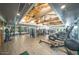 Bright gym with high wood ceilings and a variety of weight training and cardio machines at 7253 E Nathan St, Mesa, AZ 85207