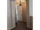 Hallway featuring a chandelier and doorway leading to another room at 7253 E Nathan St, Mesa, AZ 85207