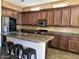 Spacious kitchen with stainless steel appliances, granite countertops, and center island at 7253 E Nathan St, Mesa, AZ 85207