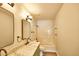 Bathroom featuring double mirrors, marble countertops and a shower with bathtub at 7259 W Tina Ln, Glendale, AZ 85310