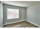 Cozy bedroom showcasing a window with blinds allowing natural light to enter the space at 7259 W Tina Ln, Glendale, AZ 85310