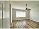 Neutral bedroom with ceiling fan and wide windows at 7259 W Tina Ln, Glendale, AZ 85310