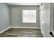 Bedroom showcasing a window with blinds and a closet with sliding doors at 7259 W Tina Ln, Glendale, AZ 85310