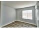 Bedroom featuring a window with blinds allowing natural light to enter the space at 7259 W Tina Ln, Glendale, AZ 85310