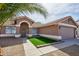 Charming single-story home with well-manicured landscaping, decorative rock, and a two-car garage at 7259 W Tina Ln, Glendale, AZ 85310