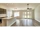 Bright, open kitchen featuring modern countertops, stainless steel faucet, and access to the backyard at 7259 W Tina Ln, Glendale, AZ 85310