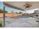 Inviting backyard features a covered patio with ceiling fan overlooking the pool and well-maintained landscaping at 7270 W Tina Ln, Glendale, AZ 85310